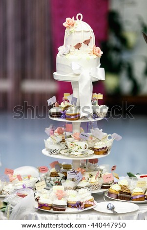 A wedding cake made of many little cupcakes