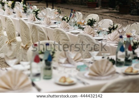 Long tables served for a rich wedding dinner