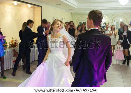 the first dance of gentle stylish happy  blonde bride and groom