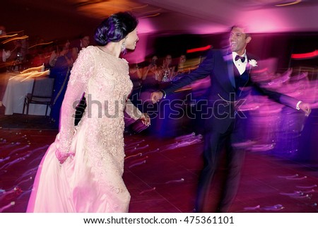 Blurred picture of magnificent Indian wedding couple dressed in European style