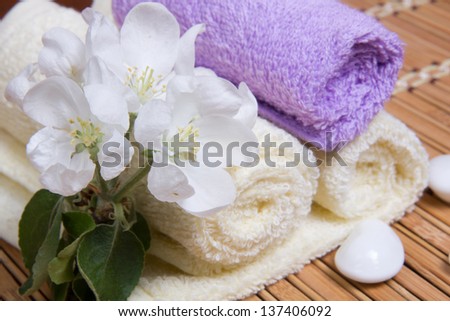 White and lavender towels, flowers apple