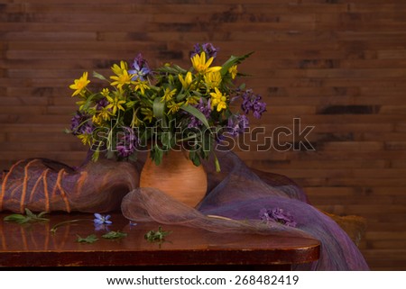 Bouquet of fresh field of wildflowers on a dark background