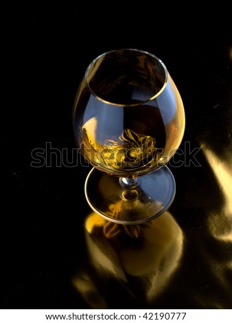 alcoholic beverage in glass on a dark background