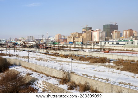 Ulaanbaatar, Mongolia - January 25, 2015: aerial view of commercial and residential buildings in Sukhbaatar District. In foreground railroad tracks. Ulaanbaatar. Mongolia.