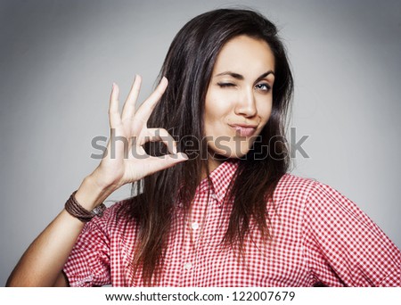 Success pretty woman showing hand ok sign