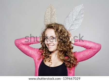 Portrait of young beautiful woman with fake ears