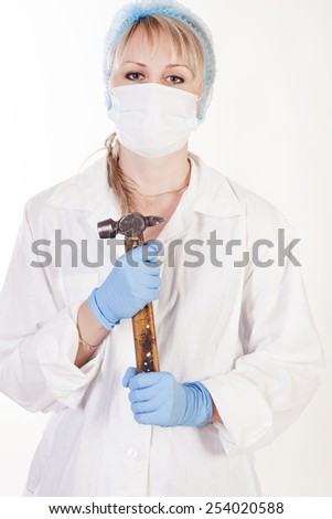 Young pretty doctor with hammer