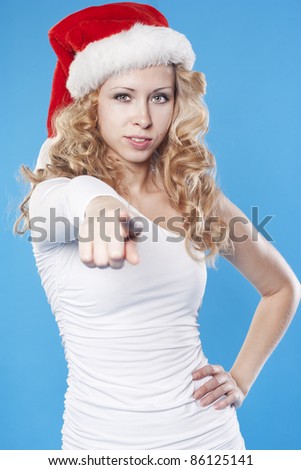 Young Santa woman pointing at you