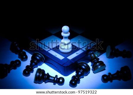 Chess board and pawns. A dark blue art background.