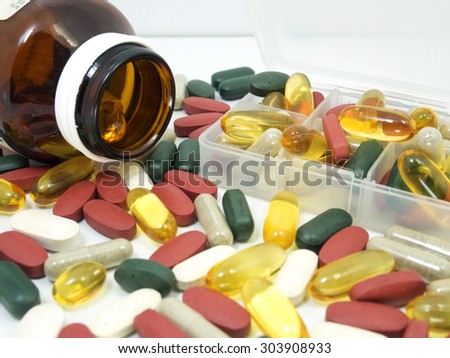 group of Vitamin with pill box,pill box,Vitamin,drug,multivitamin, herbal supplement capsules,fish oil,Natural organic green algae tablets,Colorful,pills and tablets, background