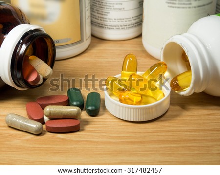 group of Vitamin with pill box,pill box,Vitamin,drug,multivitamin, herbal supplement capsules,fish oil,Natural organic green algae tablets,Colorful,pills and tablets