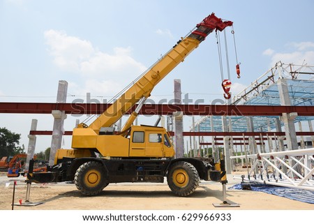 Mobile Crane stand by waiting for eriction steel roof truss