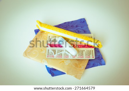 Woman hygiene protection, close-up.menstruation calendar with cotton tampons,orange Gerber,Sanitary pads on a red background