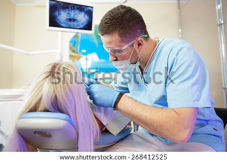 Patient girl in dentist. Dental clinic