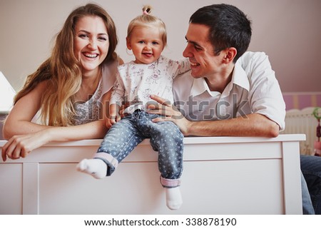beautiful family of three people, mom dad and daughter