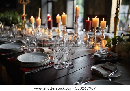 Table setting set with candles and flowers