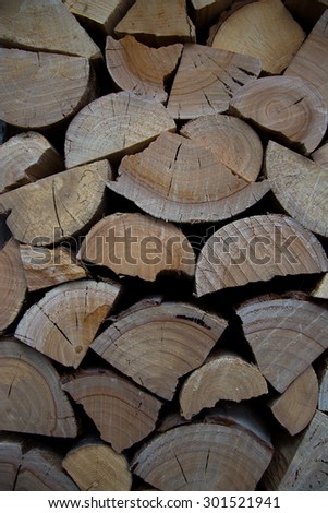 Log pile - stack of seasoned and split firewood ready for the cold winter nights.