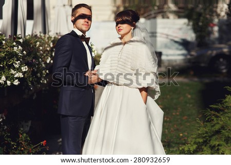 Shadow falls on the eyes of the groom and bride