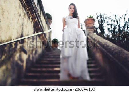 beautiful cute happy young italian bride posing in old stairs of tivoli italy