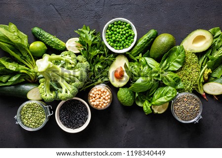 Source of protein for vegetarians. Top view healthy food clean eating: vegetable, seeds, superfood, leaf vegetable on dark background
