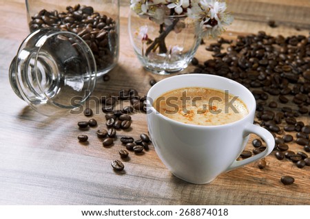 Natural coffee on a wooden table. Near the cafe is worth Bank of coffee beans