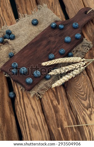 blueberries on a wooden table. Copy space. A place to put the object. top view