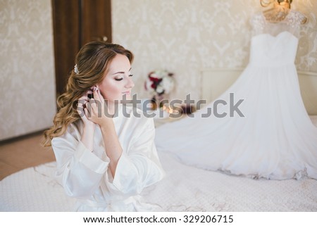 Happy bride having her wedding preparations