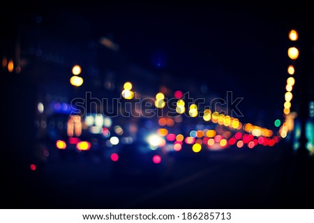 Traffic lights of the night city road.