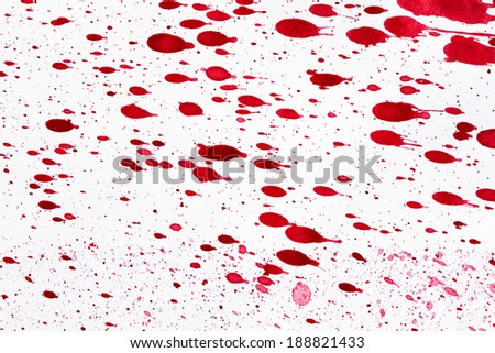 red ink blots on a textured paper