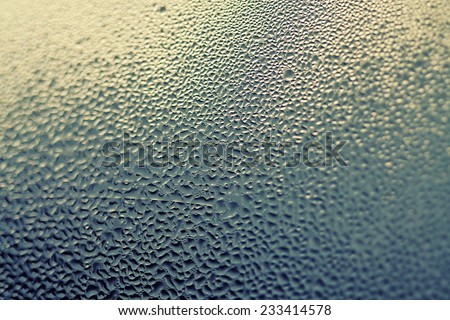 rain drops on the window glass in a cloudy day