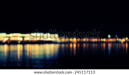 defocused street lamps and reflection on a water, natural photo image