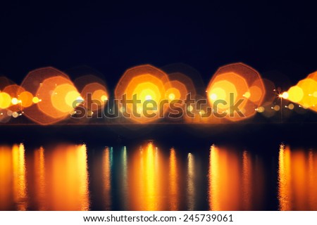 defocused street lamps and reflection on a water, natural photo image