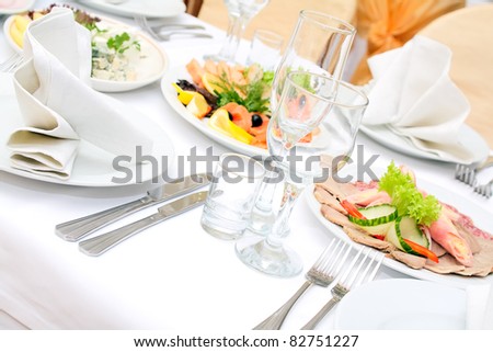 The served dinner table in a restaurant.