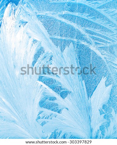 frost pattern on a windowpane closeup, high key effect
