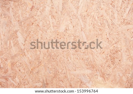 Bright brown chipboard texture abstract, particleboard surface background in horizontal orientation, nobody.