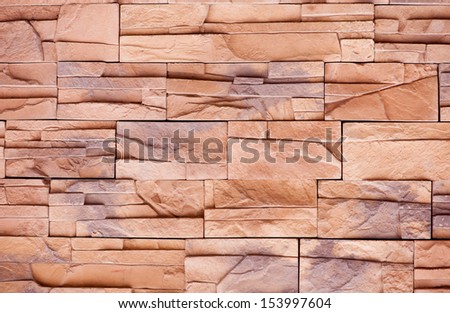 Slate tiles brown purple rock abstract, wall cladding detail, fine-grained rock decoration on building in beige with purple color mix, wall surface background in horizontal orientation, nobody.