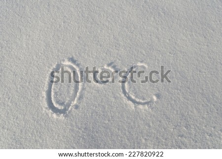 Zero degree Celsius imprint in snow, plain snowy surface background, white season in weather, horizontal orientation, nobody.