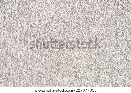 White grained wall surface texture abstract, bright wall surface detail background in horizontal orientation, nobody.