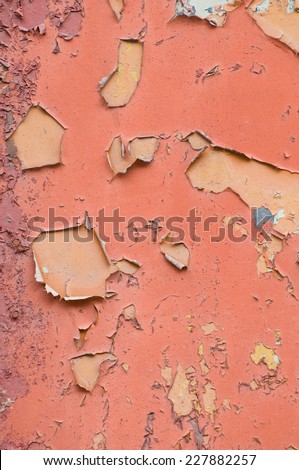 Brown old obsolete cracked paint texture wall abstract, damaged paint surface abstract, bright brown background in vertical orientation, nobody.