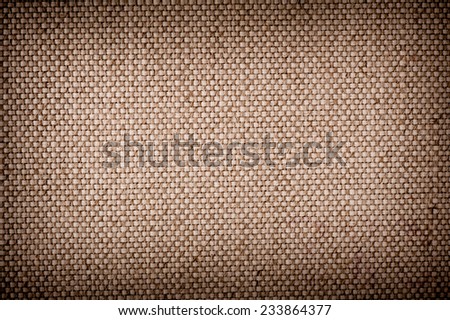 Beige burlap cloth texture abstract, hessian plain seamless surface with dark vignette background in horizontal orientation, nobody.