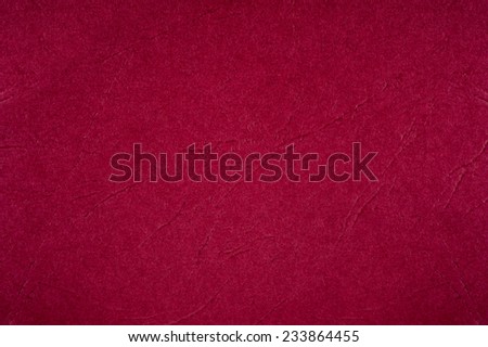 Dark red ragged cardboard texture abstract, paper plain grainy surface background in horizontal orientation, nobody.
