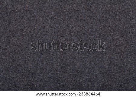 Dark grey flat cardboard texture abstract, paper plain filament smooth surface background in horizontal orientation