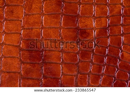 Rusty snake leather cloth imitation, sheet texture abstract, bright brown tinted wrinkled material surface background in horizontal orientation, nobody.