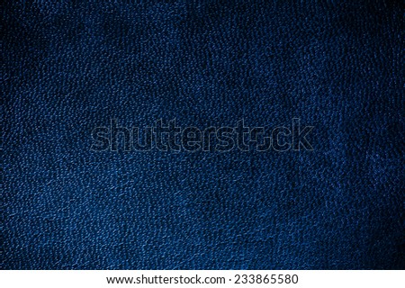 Navy glossy leather texture abstract, iridescent material dark blue toned, rough surface background in horizontal orientation, nobody.