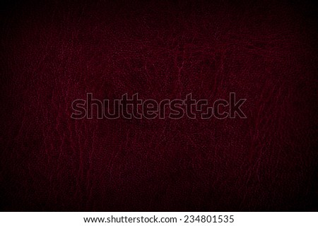 Claret leather sheet texture abstract with black vignette, material grunge surface background in horizontal orientation, digitally altered, nobody.