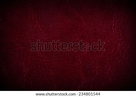 Maroon porous leather sheet texture abstract, claret tinted leather imitation, wrinkled material surface background in horizontal orientation, nobody