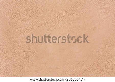 Beige wrinkled leather cloth texture abstract, bright rough plain seamless surface background in horizontal orientation, nobody.
