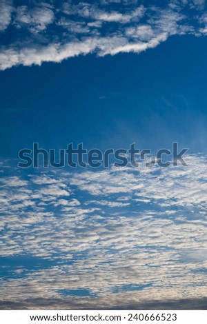 Altocumulus cloudscape view and blue sky sunny weather in Poland, Europe. Vertical orientation, nobody.