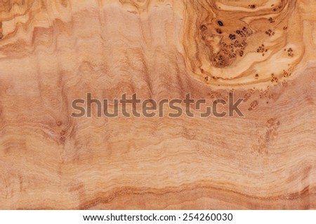 Olive wood plain texture abstract, bright brown chopping board surface in horizontal orientation, nobody.