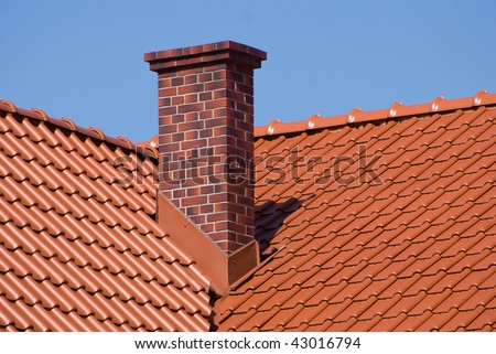 Overlapping rows of red tiles sheet roof with chimney zoom, new building construction of high section in Poland, ridge tiling material regular pattern in horizontal orientation, nobody.